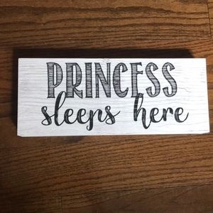 “Princess Sleeps Here” wall plaque $10 each or free with $50 purchase.
